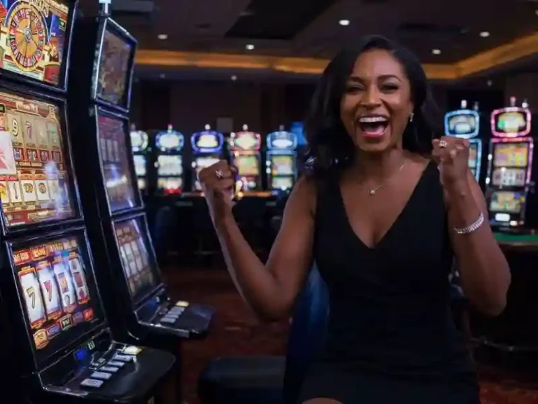 Vivamaxhd PH winner beams as slot machine lights flash with success.